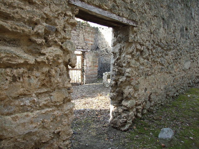 I.2.19 Pompeii. March 2009. Rear entrance doorway, and room on south side of doorway. Taken from doorway from I.2.17. Looking south-east.