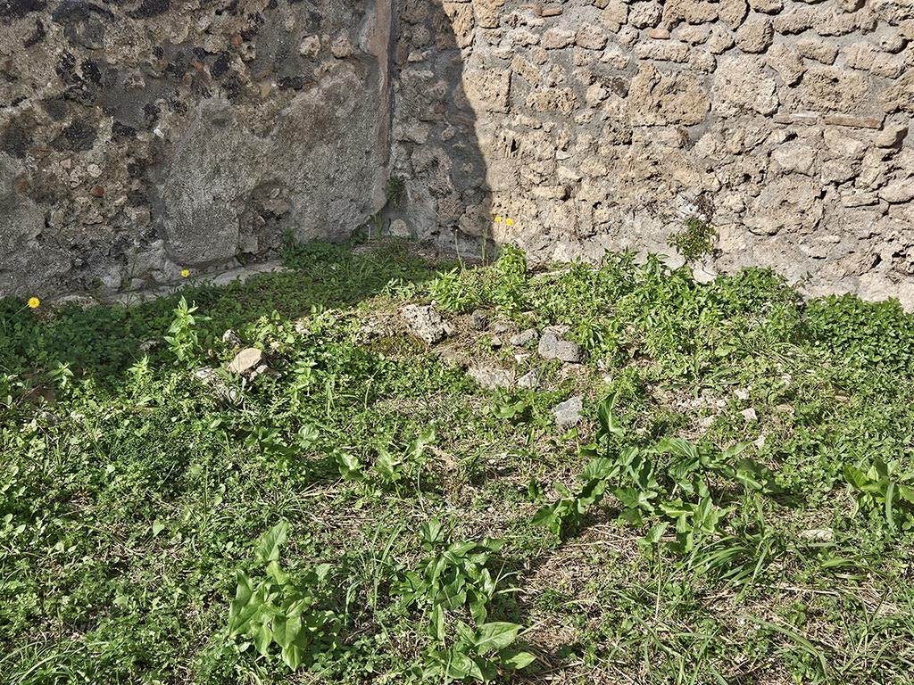 I.2.20 Pompeii. November 2024.
North-west corner of garden area with remains of two-sided biclinium. Photo courtesy of Annette Haug.