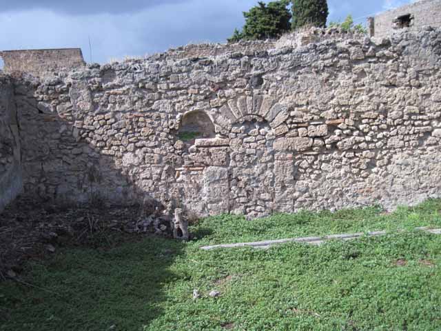 I.2.20 Pompeii.  March 2009. Site of staircase to upper floor, and two small rear rooms in south west corner of garden area.