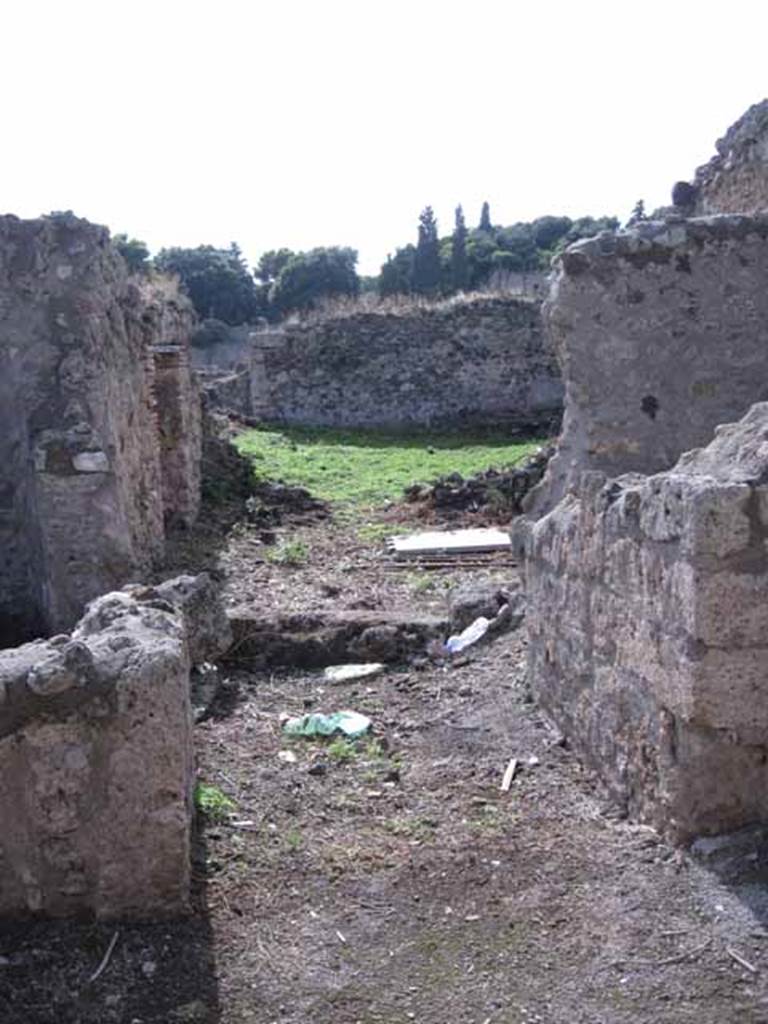 I.2.20 Pompeii. September 2010. Looking west from entrance, across small atrium,with doorway to kitchen, on the left. Photo courtesy of Drew Baker.

