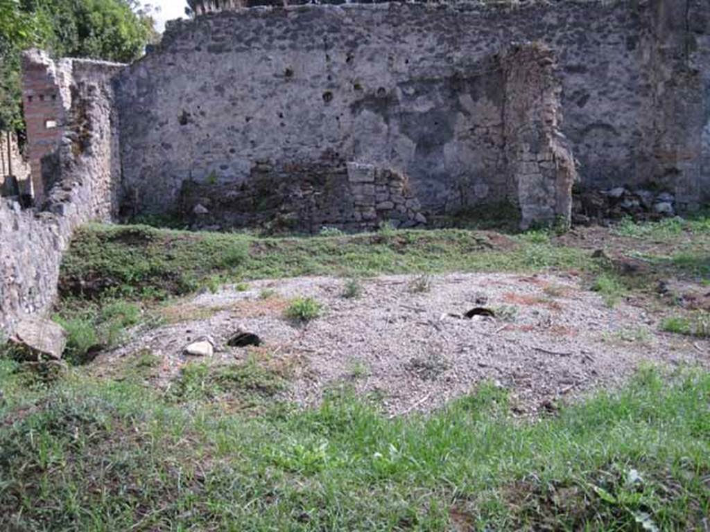 I.2.24 Pompeii. September 2010. Looking south across peristyle over remains of the triclinium, towards the three rooms on the south side.
Photo courtesy of Drew Baker.