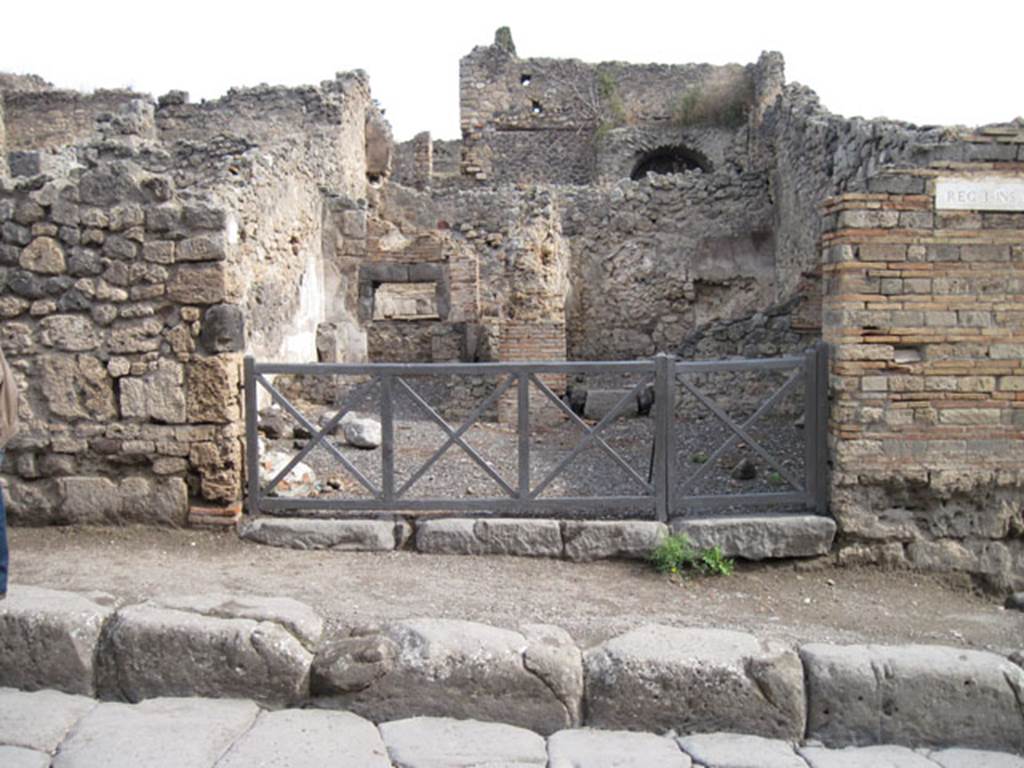 I.3.1 Pompeii. March 2009. North side of bakery shop, with site of steps to upper floor and oven in north east corner.