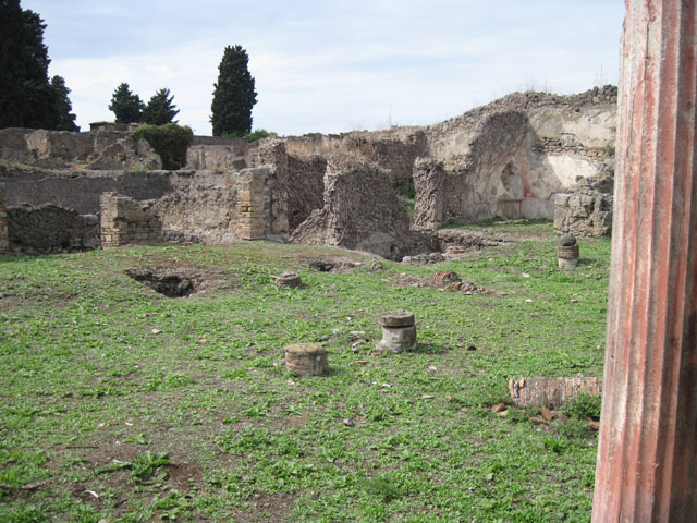 I.3.3 Pompeii. September 2010. Upper peristyle area, looking west down rooms below in collapsed area and through two doorways into the yard area of lower house.
Photo courtesy of Drew Baker.