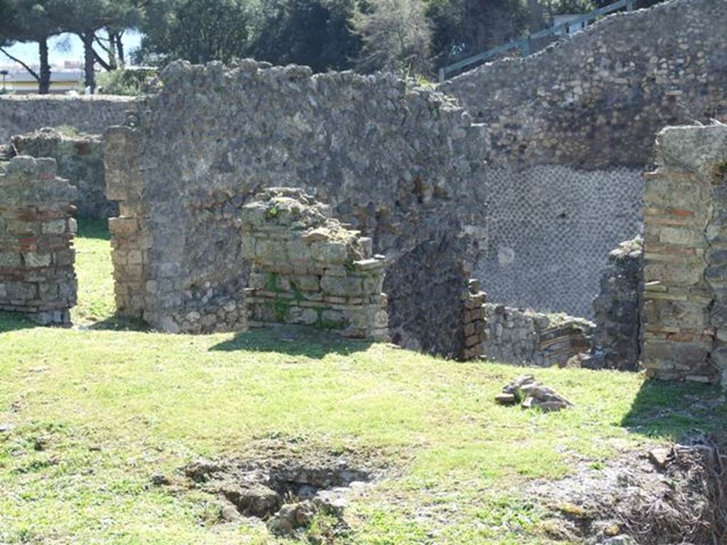 1.3.3 Pompeii. March 2009.  Remains of doorways to two rooms, the corridor and oecus, leading from the west portico on upper peristyle level. According to Fiorelli, �To the right of the staircase was located a spacious oecus, situated above the second of the indicated triclinia, afterwards comes a corridor with a sloping floor, that was above the other corridor on the first (lower) floor carrying the pavements of the roof to the rooms on the south side of the atrium�.  See Pappalardo, U., 2001. La Descrizione di Pompei per Giuseppe Fiorelli (1875). Napoli: Massa Editore. (p.38)

