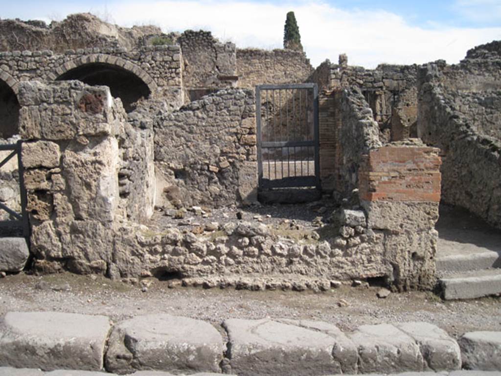 I.3.4 Pompeii. December 2007. East wall of shop, with doorway at rear of shop connecting to atrium of I.3.3.
