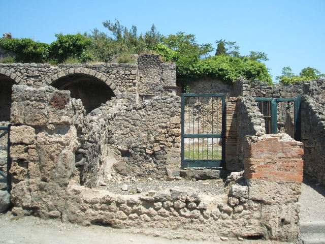 I.3.4 Pompeii. September 2010. Looking towards the eastern wall and doorway into I.3.3, from the entrance doorway. Photo courtesy of Drew Baker.
