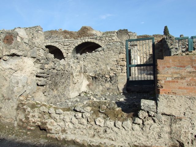 I.3.4 Pompeii. September 2010. South wall and south-west corner of the shop, looking west onto Via Stabiana. Photo courtesy of Drew Baker.
