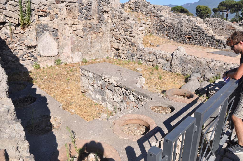 I.3.11 Pompeii. September 2010. Looking north across counter towards north wall and north-west corner. Photo courtesy of Drew Baker.
