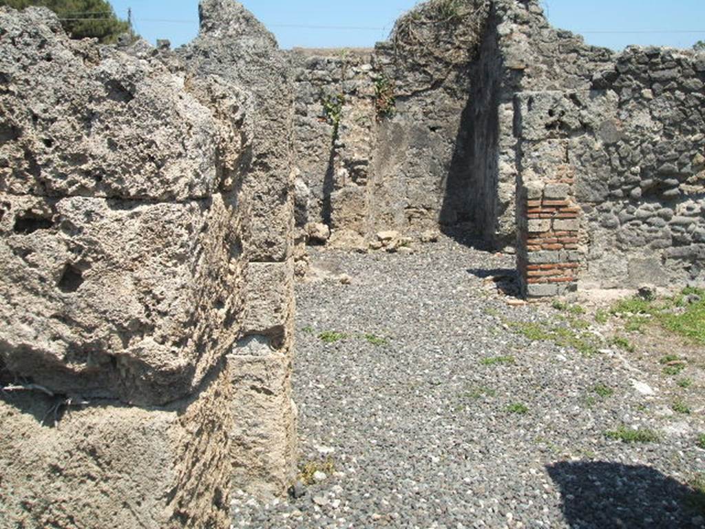 I.3.20 Pompeii. May 2005. Looking east along north side of peristyle.
According to Jashemski –
The garden at the rear of the house had a passageway on the north and west.
There was a gutter around the east, north and west edges of the garden.
Four large dolia were buried in the garden. A large triclinium along the east side of the garden had a window overlooking into the garden.
The remains of one couch of a masonry triclinium in the west passageway suggested to Fiorelli that formerly there might have been a room there, destroyed by the earthquake. There was a terracotta puteal in this passageway, and a small altar on the right-side of the peristyle.
See Jashemski, W. F., 1993. The Gardens of Pompeii, Volume II: Appendices. New York: Caratzas. (p.27).
According to Soprano –
Ubicazione: peristilio.
Bibliog. Fiorelli, op.c., p.56.
Il Fiorelli afferma che nell’ambulacro del peristilio c’erano tracce di ‘un letto tricliniare di fabbrica’.
Le tracce viste dal Fiorelli non sono oggivisibili.
See Soprano, P. (1950). I triclini all’aperto di Pompei. (In Pompeiana, raccolta di studi per il secondo centenario degli scavi di Pompei. Napoli, Gaetano Macchiaroli, Editore, p.308, no.36.