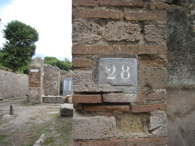 I.3.28 Pompeii. March 2009. Counter with three urns.