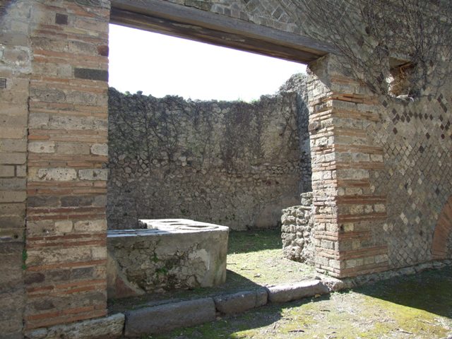I.3.28 Pompeii. September 2010. Niche in south wall behind counter. Photo courtesy of Drew Baker.
