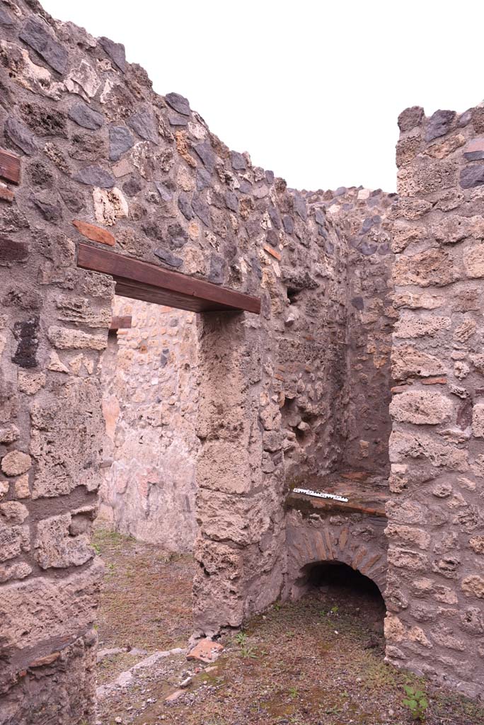 I.4.4 Pompeii. October 2019. West wall with doorway into shop-room, and hearth in north-west corner. 
Foto Tobias Busen, ERC Grant 681269 D�COR.
