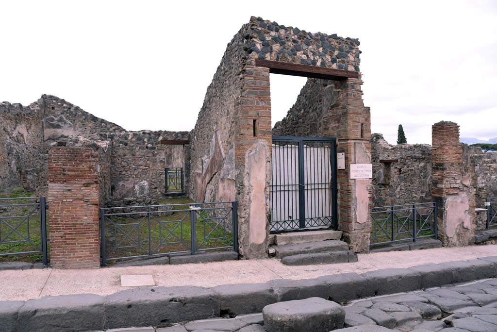 I.4.6, centre left, I.4.5, in centre, and I.4.4, centre right, Pompeii. October 2019. Looking east towards entrance doorways. 
Foto Tobias Busen, ERC Grant 681269 D�COR.
