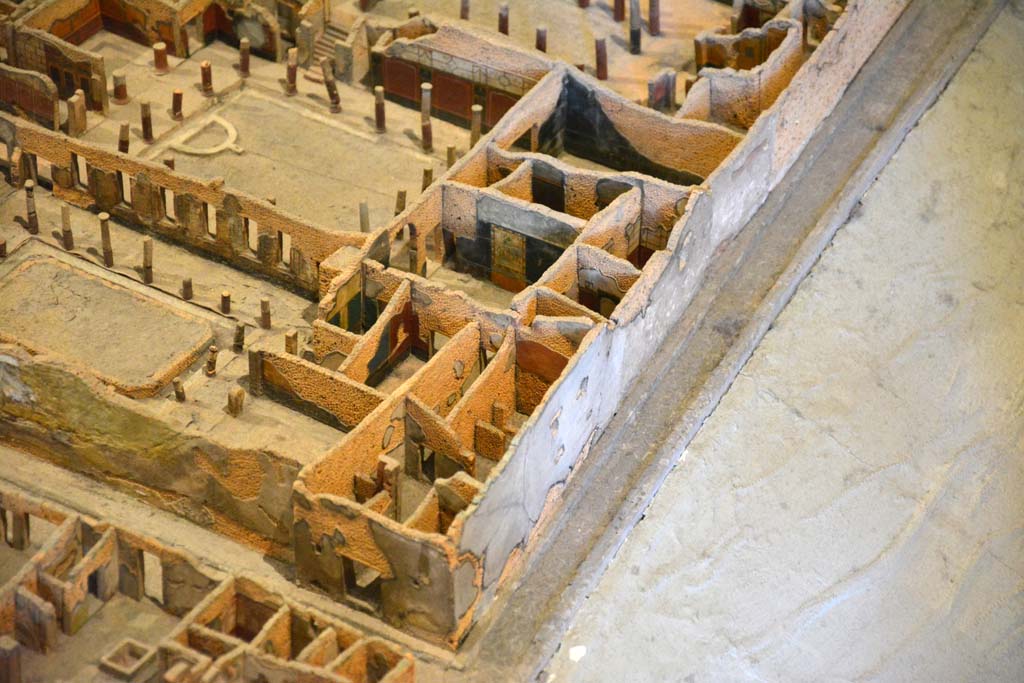 I.4.28 Pompeii. May 2019. Detail from model in Naples Archaeological Museum.
Looking north towards entrance doorway on corner of Vicolo del Menandro, and Vicolo del Citarista.
Foto Tobias Busen, ERC Grant 681269 D�COR.
