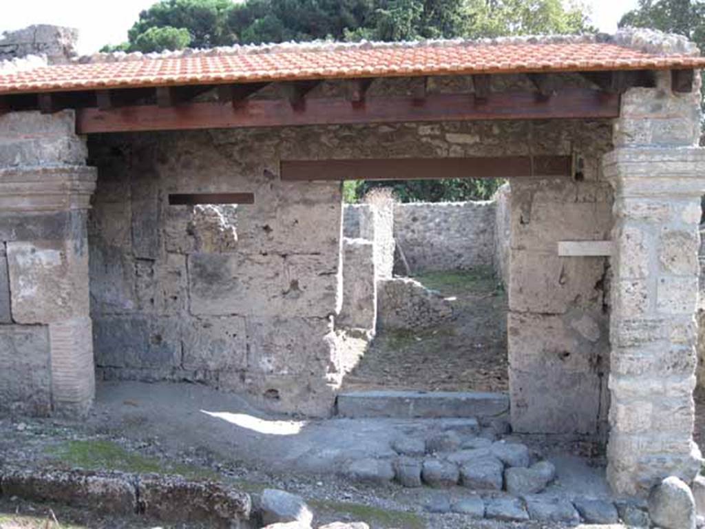 I.5.1 Pompeii. September 2010. Entrance with restored portico looking south towards rear. Photo courtesy of Drew Baker.