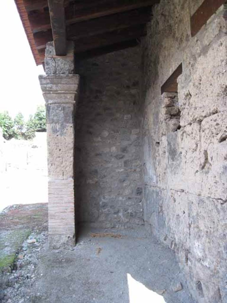 I.5.1 Pompeii. September 2010. Left (east) ante of restored portico looking east along Vicolo del Conciapelle towards unexcavated region. Photo courtesy of Drew Baker.