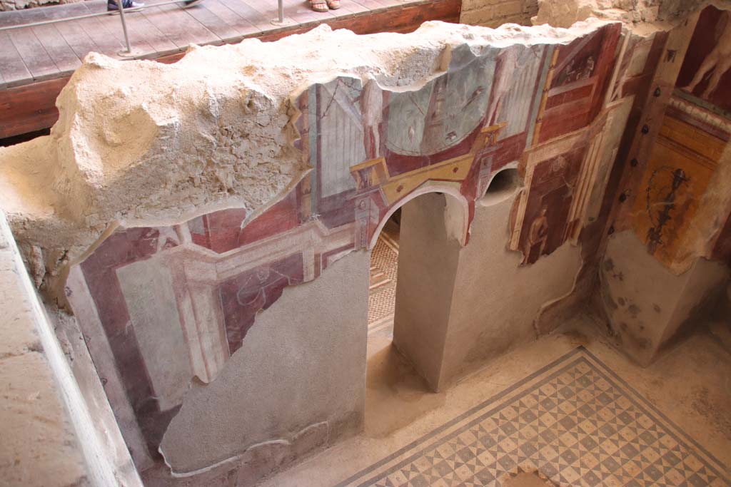 I.6.2 Pompeii. September 2019. Looking down on south wall of frigidarium, with arched doorway to anteroom or changing room.
Photo courtesy of Klaus Heese.
