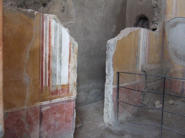 II.6.4 Pompeii. March 2009. Room 5, Detail of remains of painted figure on south wall, east end.