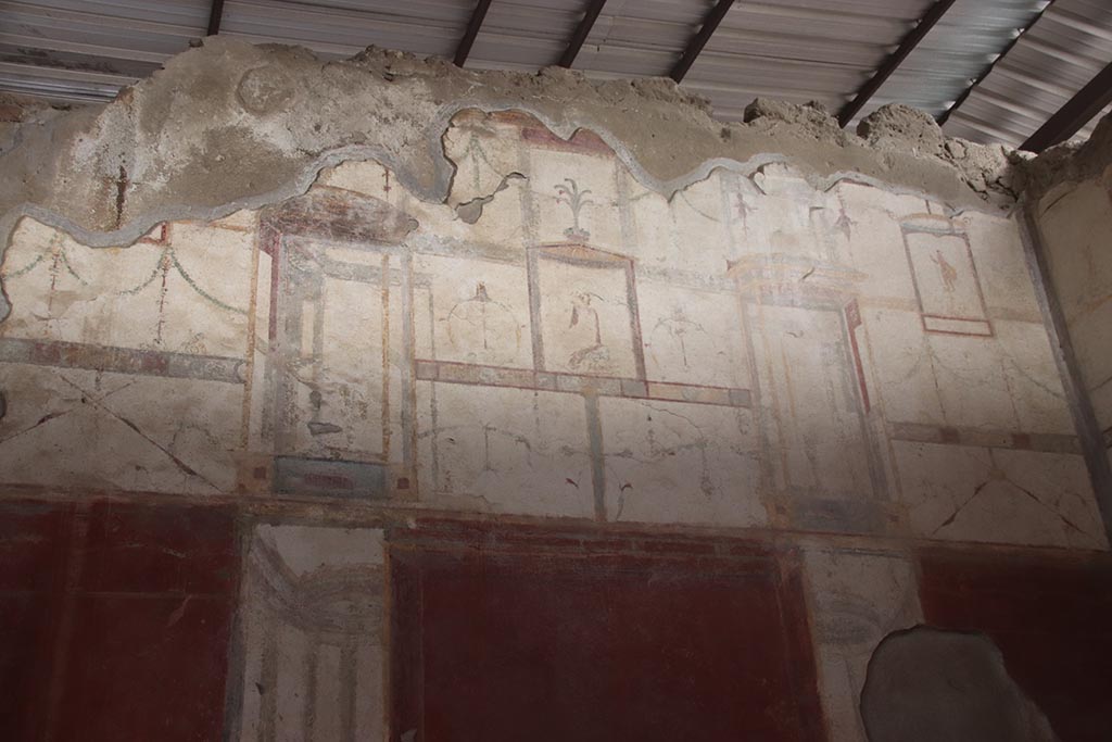 I.6.4 Pompeii.  March 2009.  Room 5, North west corner. Painted flying figure on west wall.