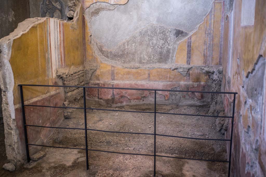 I.6.4 Pompeii. December 2021.
Room 4, looking towards east wall, site of remains of impression of bed in the ash. Photo courtesy of Johannes Eber.