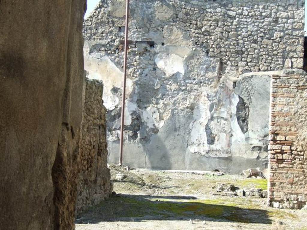 I.6.13 Pompeii. March 2009. Looking north through tablinum to remains of small garden area.
According to Jashemski �
�The small garden at the rear of the house, which was undergoing extensive repairs at the time of the eruption, was originally outlined by a low masonry wall.
There were remnants of a garden painting on the rear wall, and a lararium niche in the east wall.
See Jashemski, W. F., 1993. The Gardens of Pompeii, Volume II: Appendices. New York: Caratzas. (p.36).
