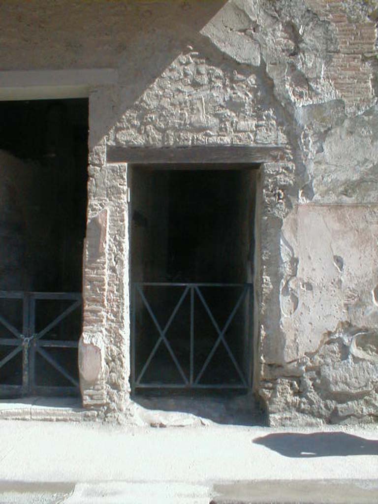 I.7.2 Pompeii. May 2005. Stairway to upper floor.
According to Della Corte, found on the west (right) of the entrance doorway were two electoral recommendations.
One for the owner, Fabius, and the other probably with his unnamed wife.
Fabius rog(at)   [CIL IV 7205]   and    Amandio cum sua rog(at)   [CIL IV 7213]
See Della Corte, M., 1965.  Case ed Abitanti di Pompei. Napoli: Fausto Fiorentino. (p.313)

According to Epigraphik-Datenbank Clauss/Slaby (See www.manfredclauss.de), these read as �

[A(ulum)  Ve]ttium  Firmum  aed(ilem)  o(ro)  v(os)  f(aciatis) 
Fabius  rog(at)       [CIL IV 7205]

Cn(aeum)  Helvium  Sabinum 
aed(ilem)  d(ignum)  r(ei)  p(ublicae)  Amandio  cum  sua  rog(at)       [CIL IV 7213]
