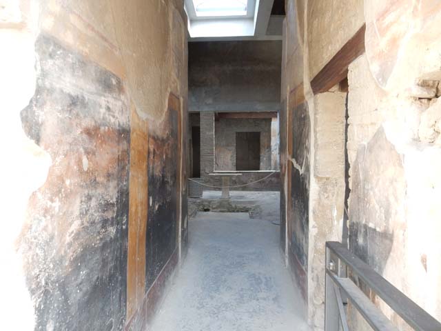 I.7.3 Pompeii. 19th October 1923. Photo courtesy of Drew Baker. West wall of atrium and small peristyle with small semicircular basin in the course of excavation. Photo taken from fauces or entrance corridor.