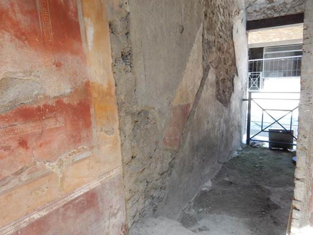 I.7.2/3 Pompeii. May 2016. Doorway in north-west corner of atrium of I.7.3, leading north to entrance at I.7.2, steps to upper floor. Photo courtesy of Buzz Ferebee.