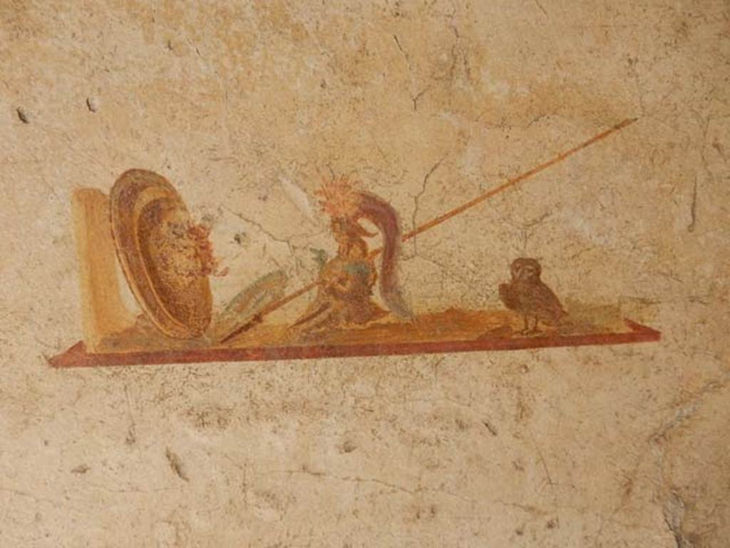 I.7.11 Pompeii. May 2017. Detail of wall painting of the attributes of Minerva/Athena in centre panel of north wall.
Photo courtesy of Buzz Ferebee.