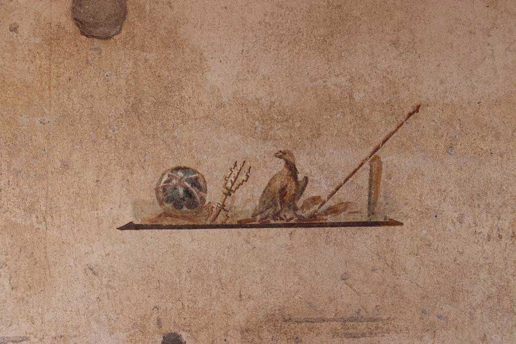 I.7.11 Pompeii. September 2021.
Wall painting of the attributes of Jupiter, from centre panel of east wall in cubiculum. Photo courtesy of Klaus Heese.