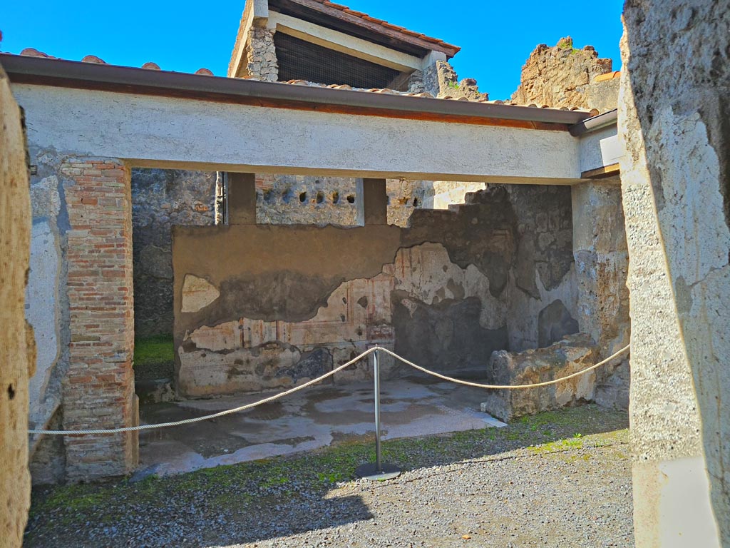I.7.11 Pompeii. March 2024. Looking west across atrium towards tablinum. Photo courtesy of Giuseppe Ciaramella.