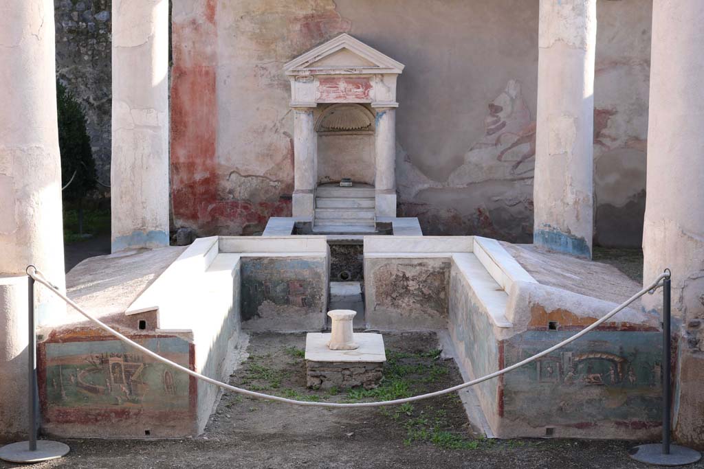 I.7.12 Pompeii. December 2018.
Looking south across summer triclinium with painted panels towards fountain against wall at rear. Photo courtesy of Aude Durand.