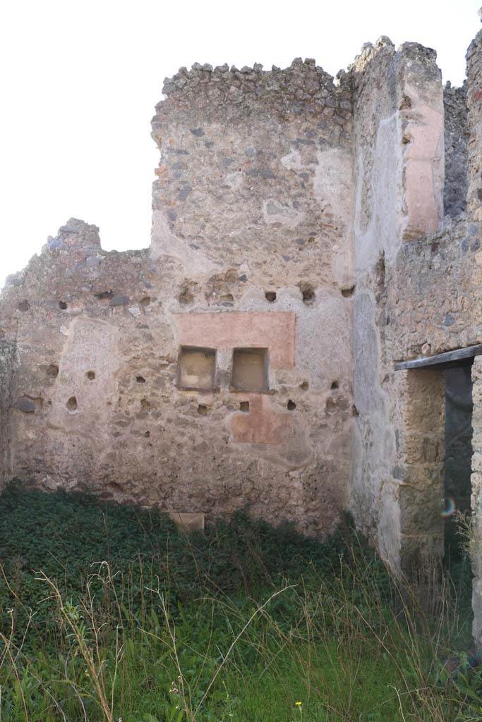 I.7.14 Pompeii. December 2018.
Looking across atrium from doorway ay I.7.13 towards west wall with two niches.
Photo courtesy of Aude Durand.