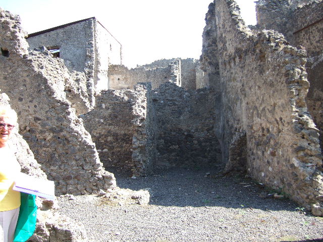I.7.17/16/15, Pompeii. Looking south from road barrier at I.7.18