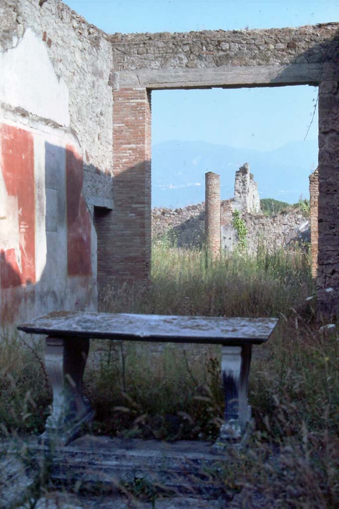 I.8.5 Pompeii. August 1976. Looking south-east across atrium towards east wall of tablinum.
Photo courtesy of Rick Bauer, from Dr George Fay’s slides collection.