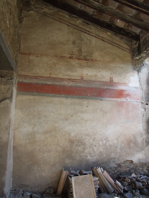 I.9 Pompeii. September 2005.  Roadway looking south.  Side wall of I.8.9
