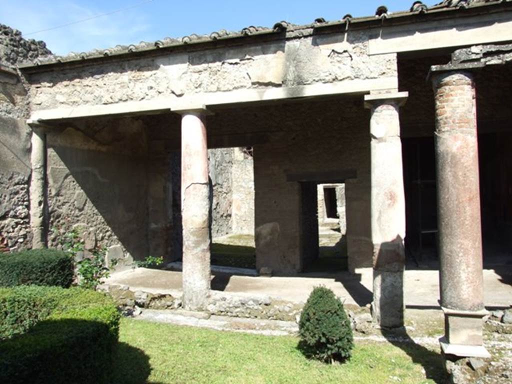 I.8.9 Pompeii.  March 2009. Room 9 and Garden area.   Looking north to portico.