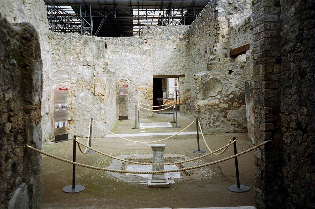 I.8.9 Pompeii. March 2010. Room 1, atrium with impluvium. Looking north to room 2, oecus. Photo courtesy of Rick Bauer.