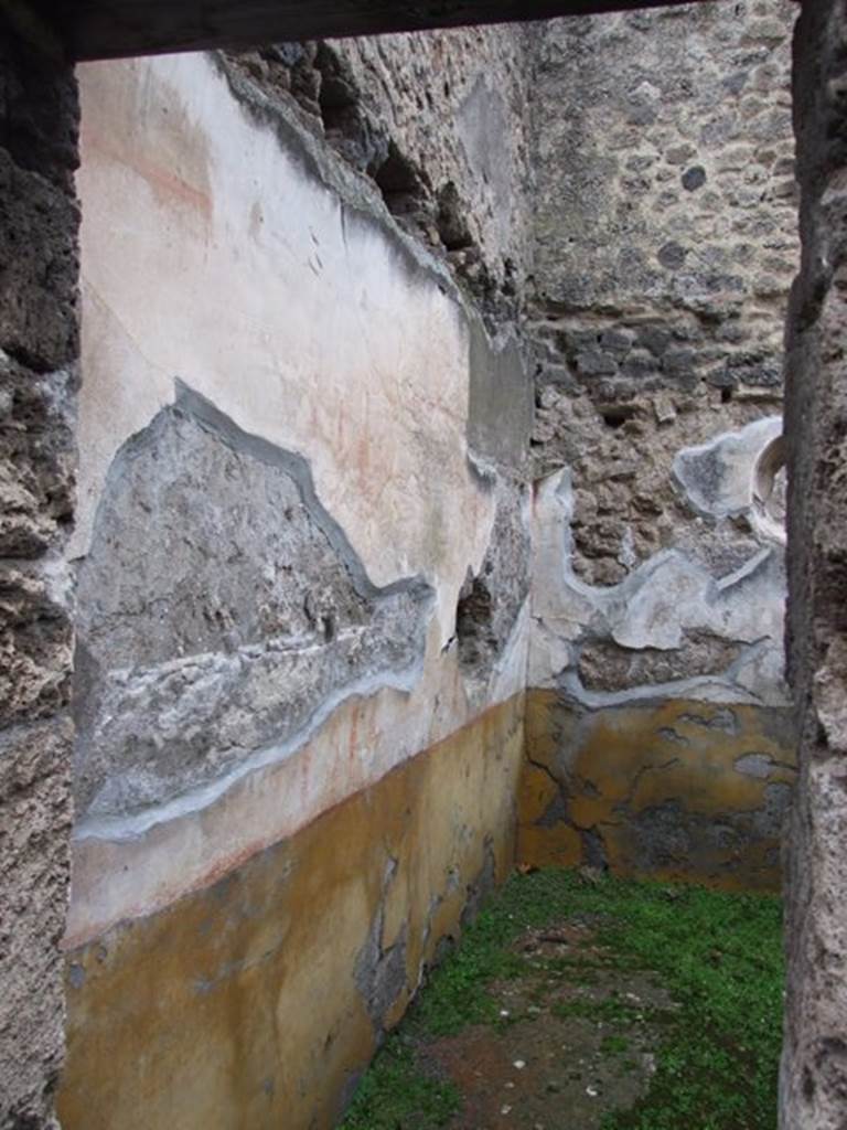 I.8.14 Pompeii. December 2007.
Room 5, cubiculum on east side of atrium, looking east along north wall towards north-east corner.
A high yellow plinth; white middle area: panels framed in red, with vignettes (a swan at the west end, Pegasus in the centre, the east end one has disappeared) and carpet borders (triangles in the central panel, drops in the lateral ones) separated by white compartments with golden candelabra. IV style.
See/Vedi Carratelli, G. P., 1990-2003. Pompei: Pitture e Mosaici: Vol. I. Roma: Istituto della enciclopedia italiana, p. 838.