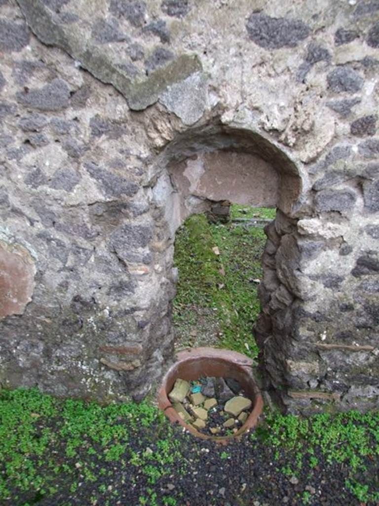 I.8.14 Pompeii. December 2007.
Courtyard 7, west wall with recess with terracotta pot at base and view through to I.8.15/16.