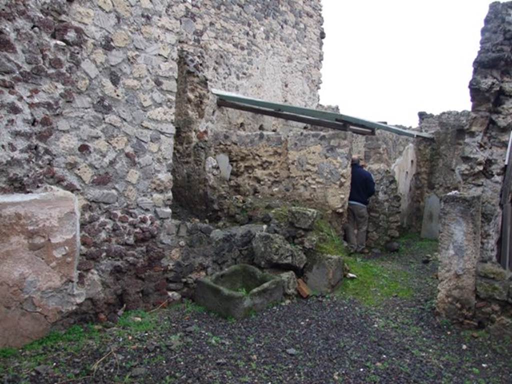 I.8.14 Pompeii. December 2007.
Courtyard 7, looking across garden area towards north-east corner, and doorway into room 8, on right.
From room (8), you enter the kitchen to the north-west, with an adjoining latrine (10) and (11), and to the east into room 9, the only one that preserves more substantial remains of pictorial decoration of the IVth Style.