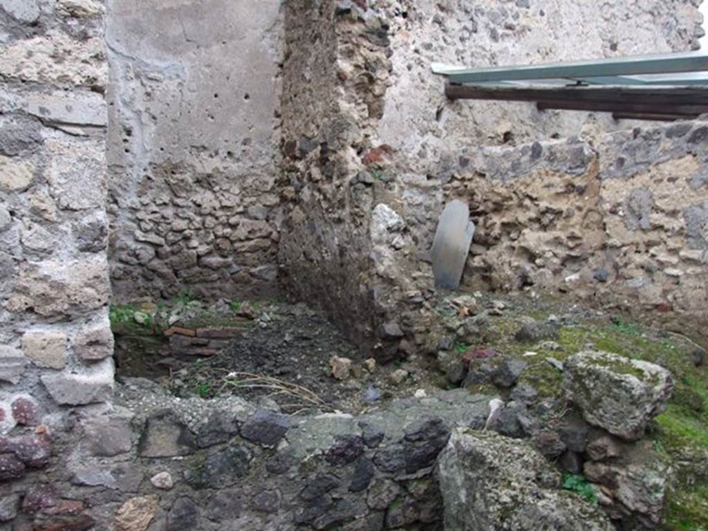 I.8.14 Pompeii. December 2007.
Room (11), latrine, and room (10), kitchen, two rooms against north wall to north of courtyard area 7, behind fallen wall.