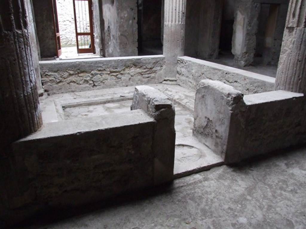 I.8.17 Pompeii. December 2007. Room 3, impluvium in atrium. Looking west towards entrance.