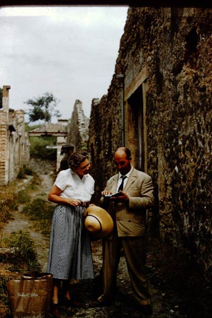 I.8.19 Pompeii. 1959. Wilhelmina and colleague outside entrance.
Vicolo dell’Efebo, looking north towards Via dell’Abbondanza.
Photo by Stanley A. Jashemski.
Source: The Wilhelmina and Stanley A. Jashemski archive in the University of Maryland Library, Special Collections (See collection page) and made available under the Creative Commons Attribution-Non-Commercial License v.4. See Licence and use details.
J59f0494