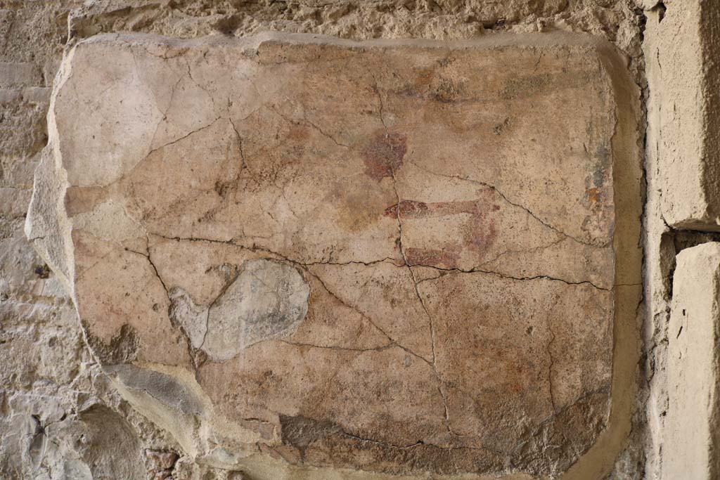 1.9.1 Pompeii. December 2018. East wall of vestibule, with remains of wall painting of Mercury and Hercules.
Hercules stood to the left and in the right of the painting is Mercury. Photo courtesy of Aude Durand.