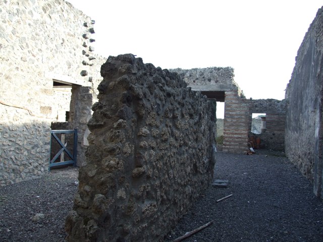I.9.3 Pompeii. March 2009. Room 1, looking towards east side of atrium.
Window to rear room connected to I.9.4, stairs to upper floor, and doorway to room 3.