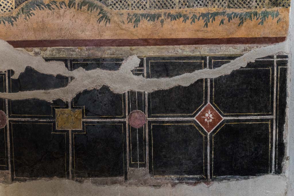 I.9.5 Pompeii. April 2022.
Room 11, looking towards zoccolo on lower east wall of cubiculum. Photo courtesy of Johannes Eber.