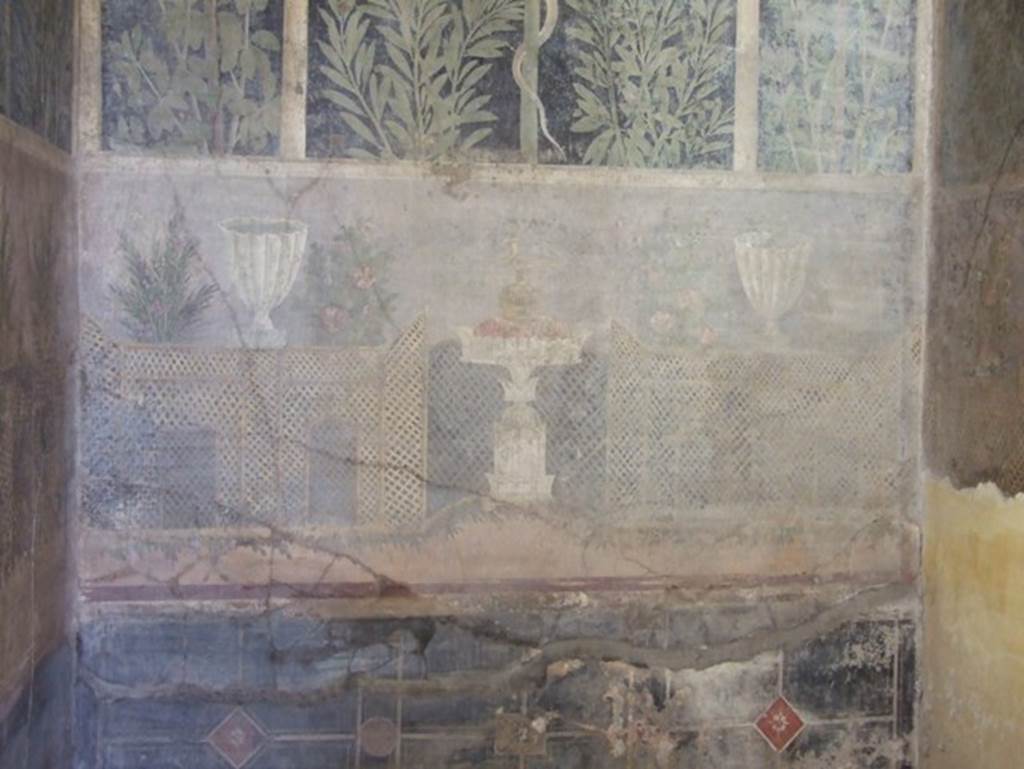 I.9.5 Pompeii. March 2009. Room 11.Cubiculum. East wall. Garden painting with lattice fencing, white vases and table with Isis jug or jar.