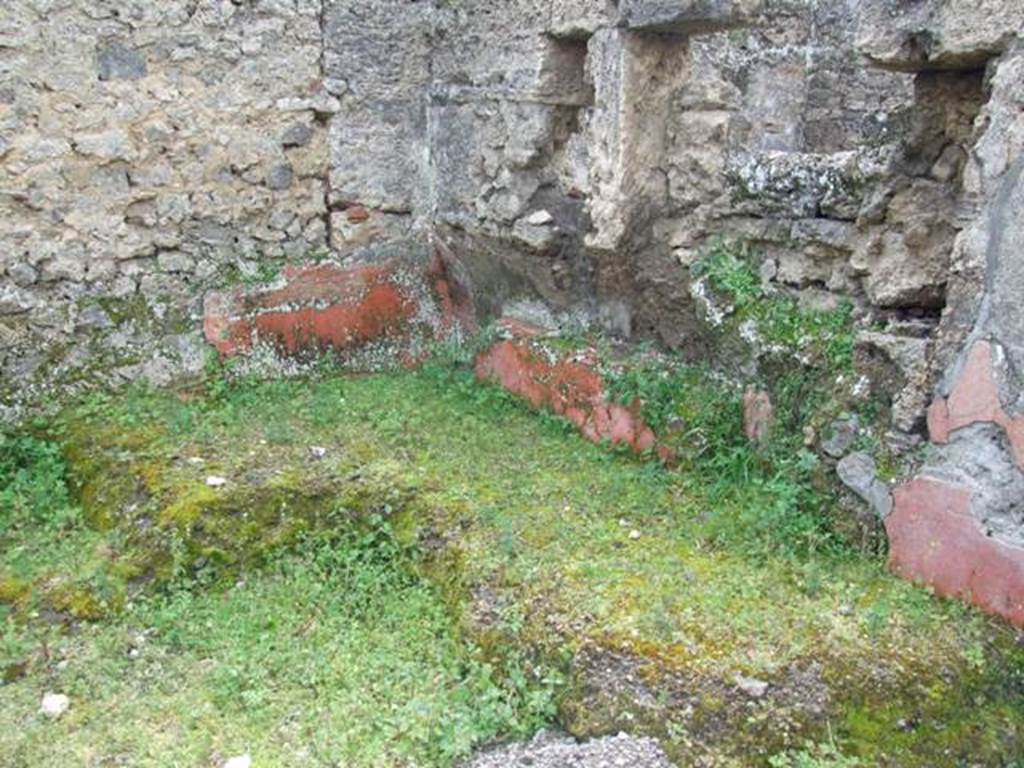 I.9.12 Pompeii. March 2009. Room 9. Remains of Triclinium In south west corner of room.