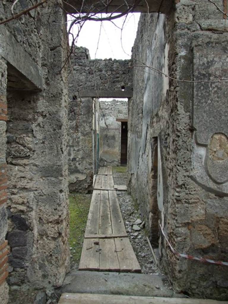 I.9.14 Pompeii. March 2009. Corridor, looking south, on south side of doorway to room 4 (on left).